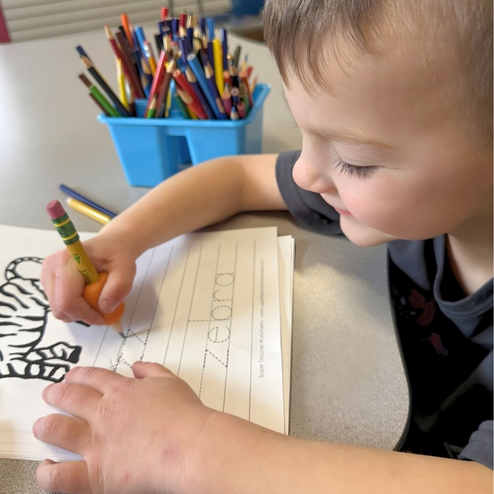 kid throwing dice and having fun at tutoring center in woodbury, ct